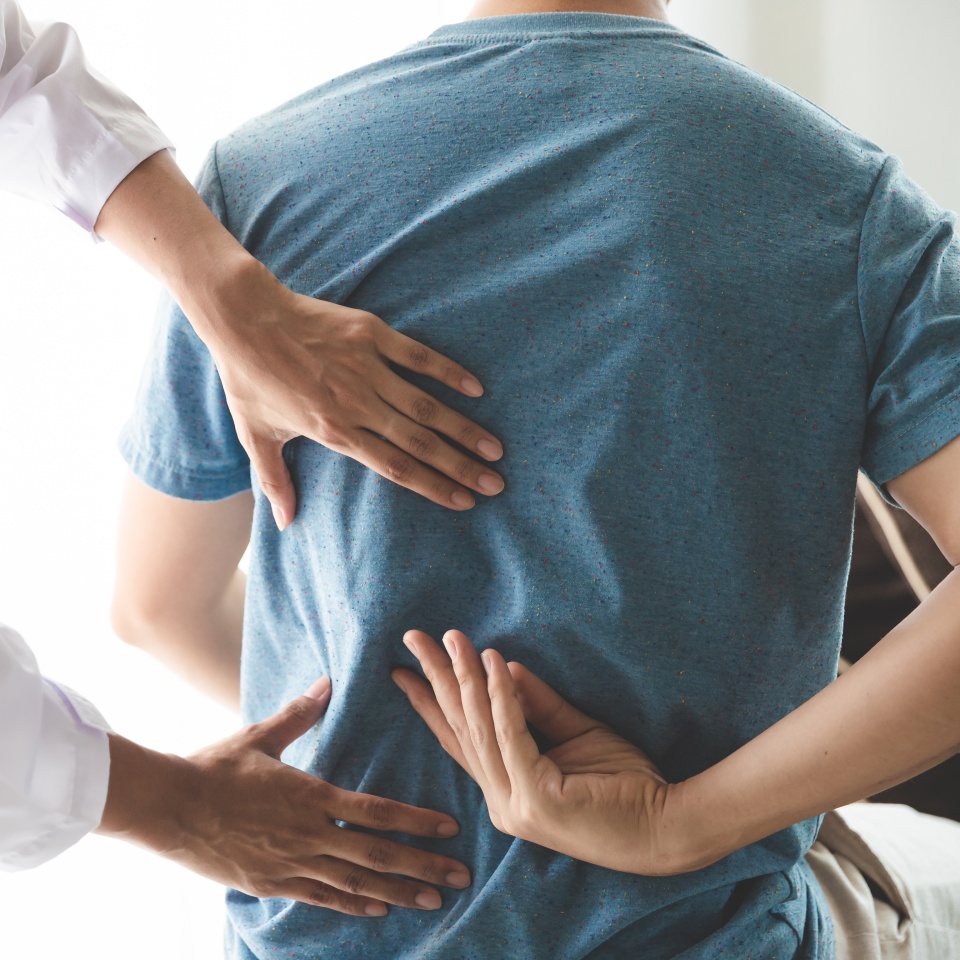 Physiotherapist working with patient in clinic, closeup