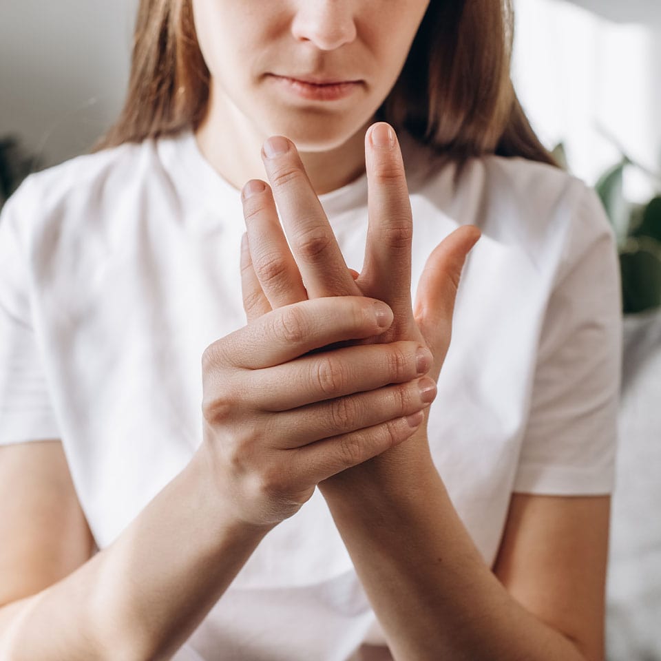 Young woman suffer from numbing pain in hand