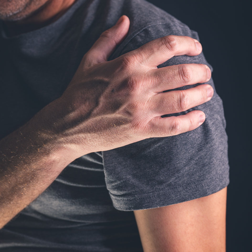 man holding his arm