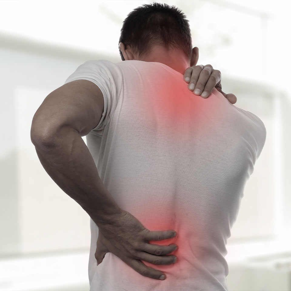 Muscular Man suffering from back and neck pain